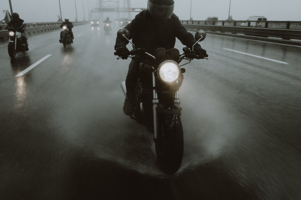 People riding motorcycles in the rain. Image by Unsplash
