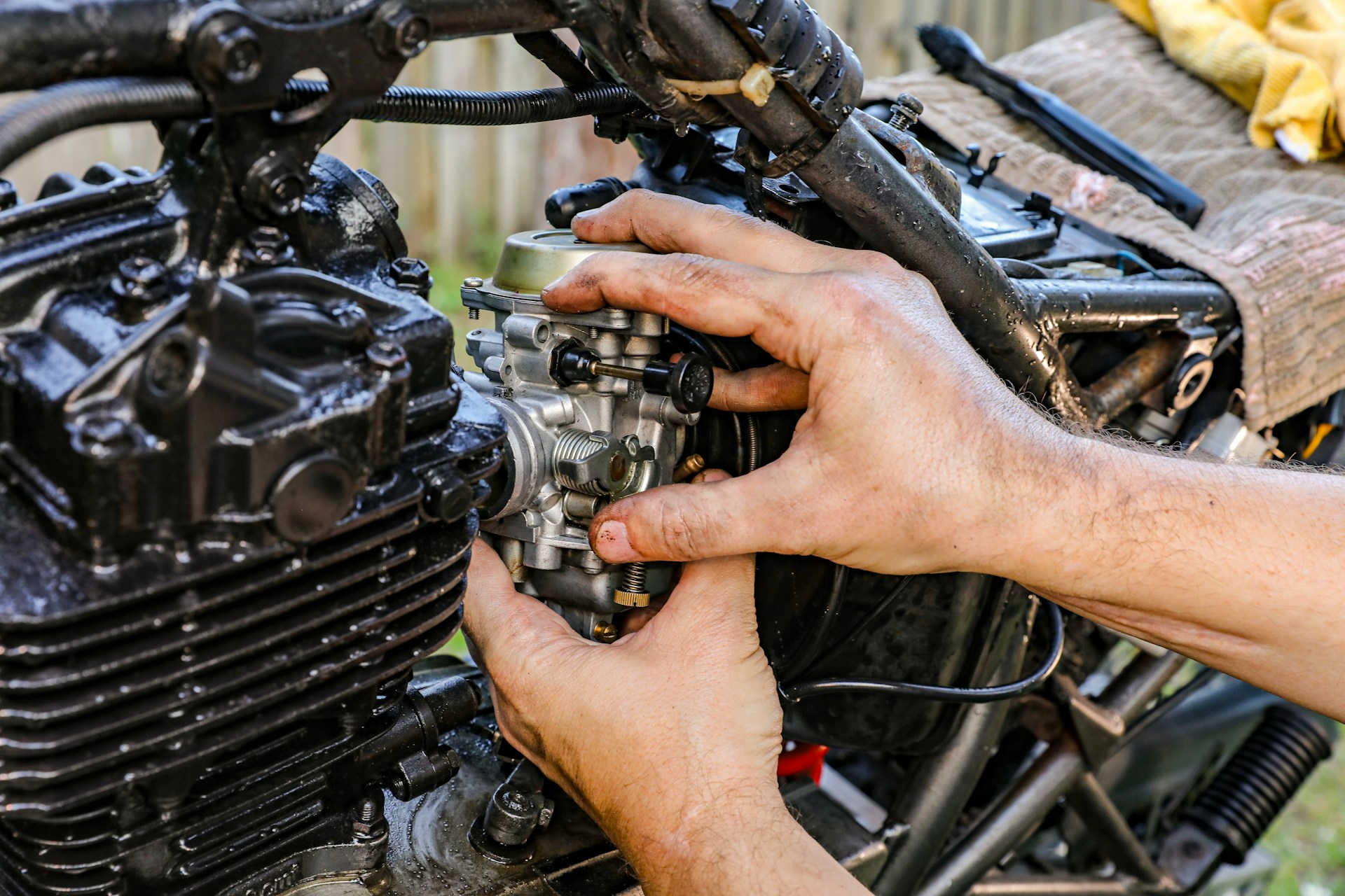 Person working on an engine. Image by Unsplash