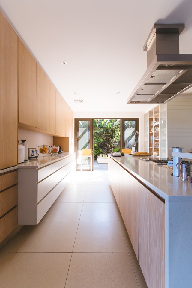 A modern, clean kitchen interior. Image by Unslash