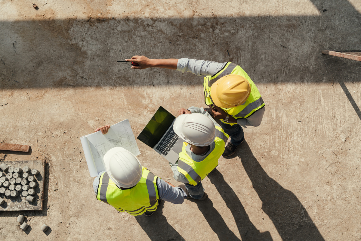 3 people wearing hard hats