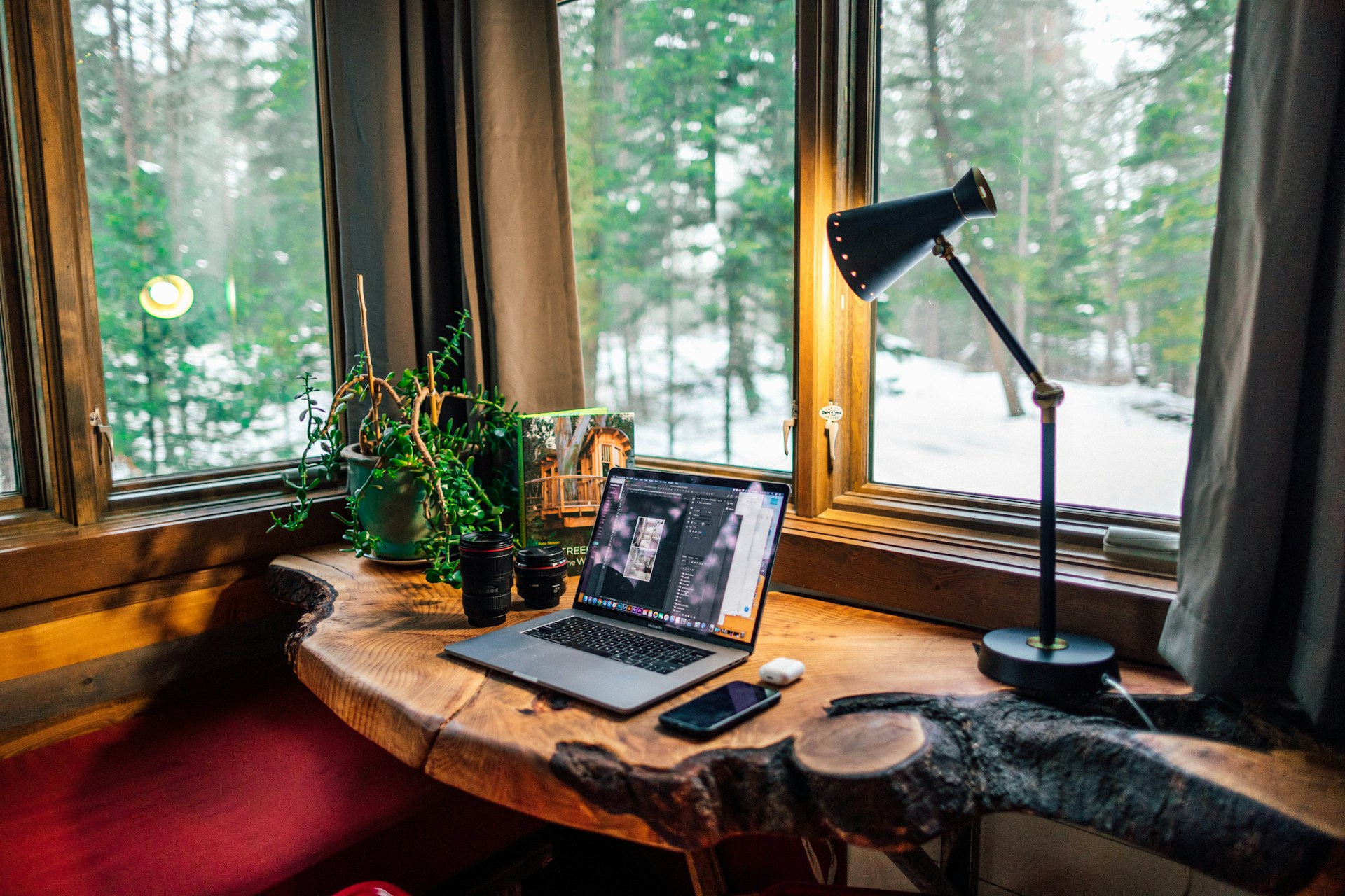 Home office. Laptop on a wood table. Image by Unsplash