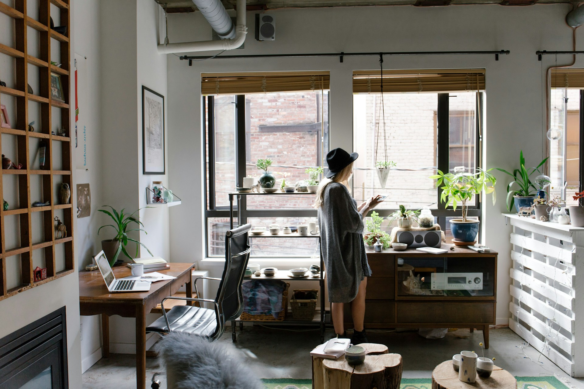 Person standing near a brown wooden cabinet. Image by Unsplash