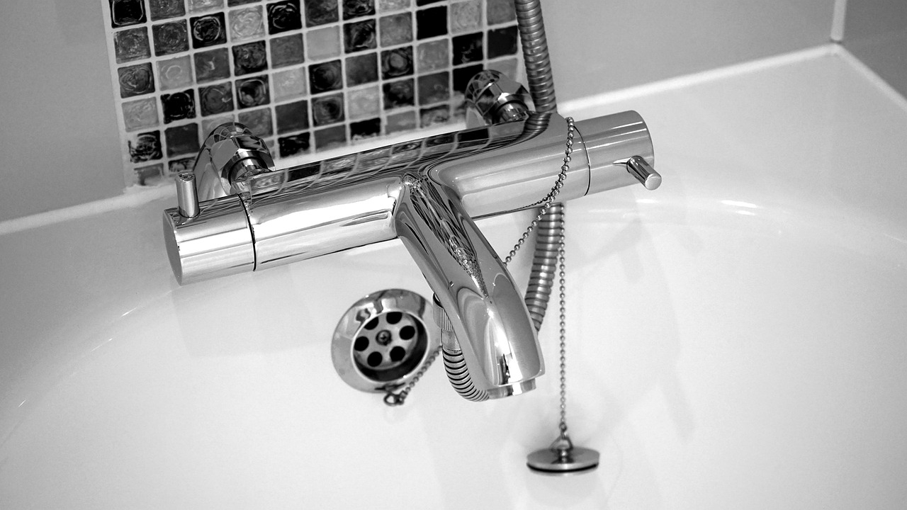 Black and white image of a bathtub faucet. Image by Pixabay