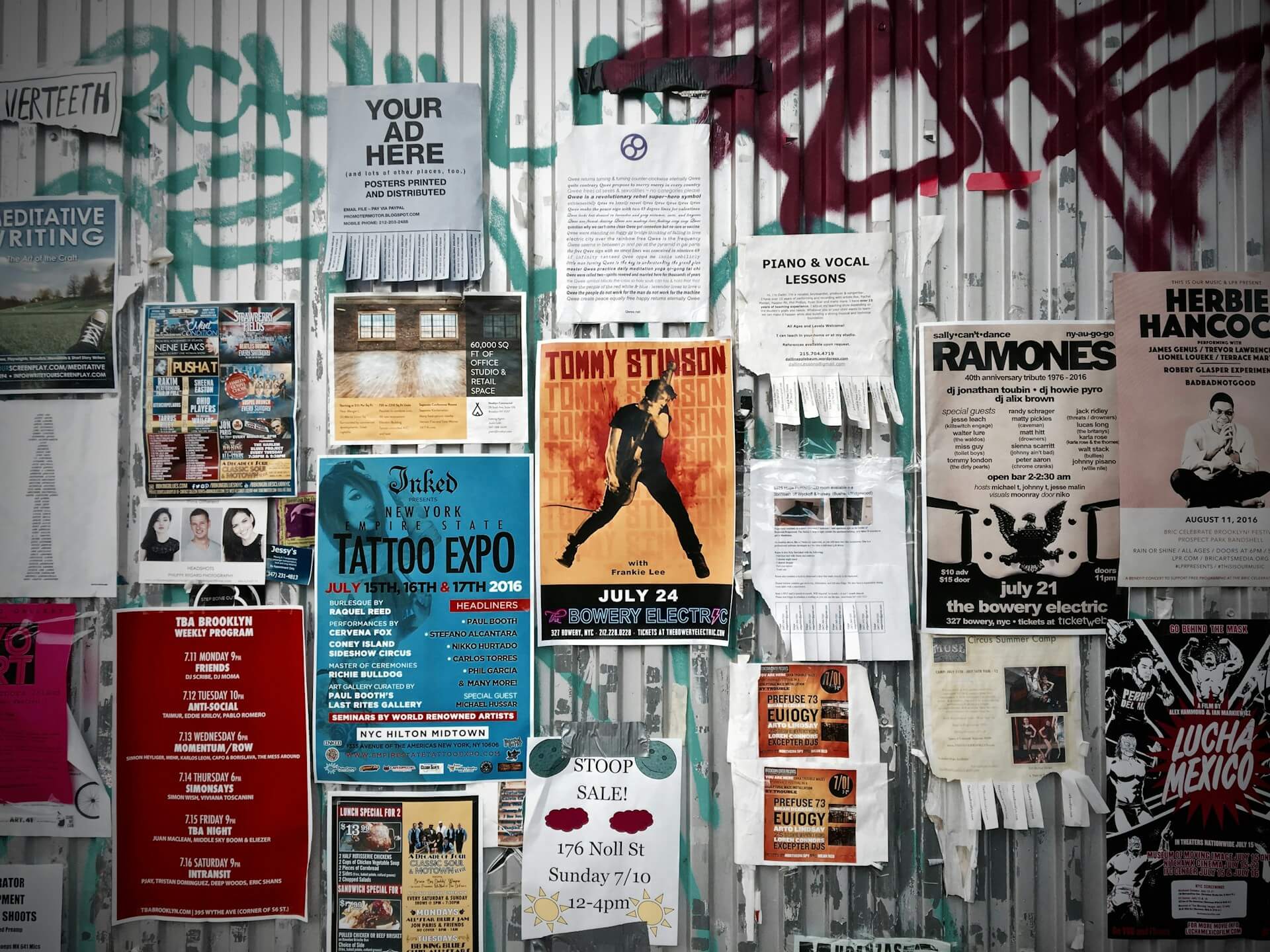 Assorted flyers on a wall. Image by Unsplash