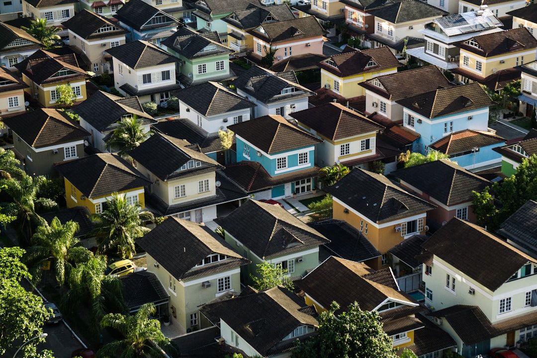 Arial view of housing in different colors. Image by Unsplash