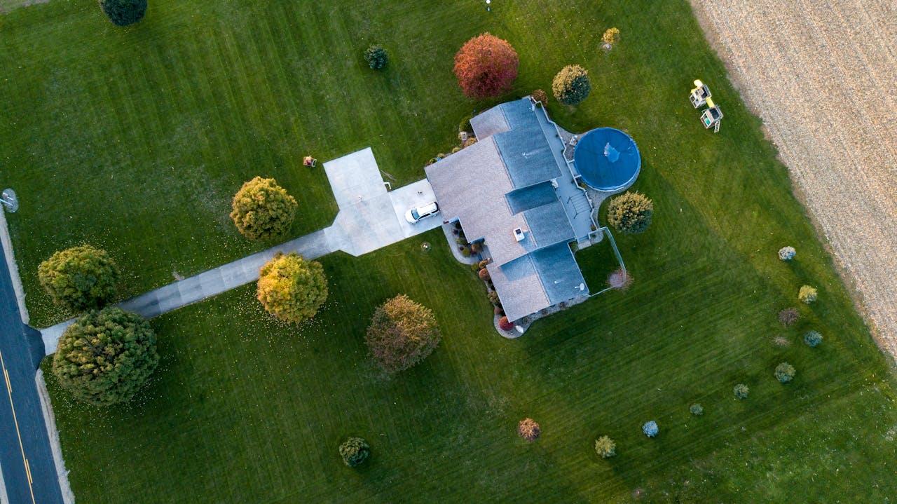 Aerial photography of a gray house with a complex roof structure. Image by Pexels