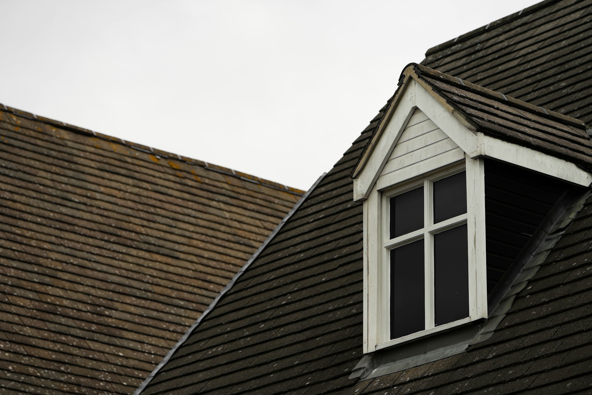 Silhouette of a man standing on a roof. Image by Unsplash