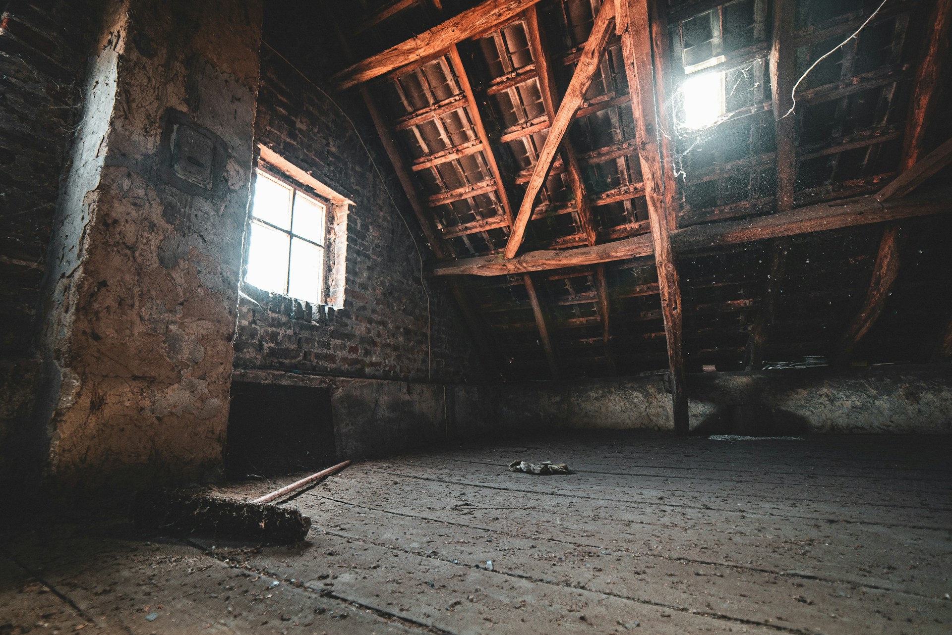Empty, dirty attic during the day. Image by Unsplash