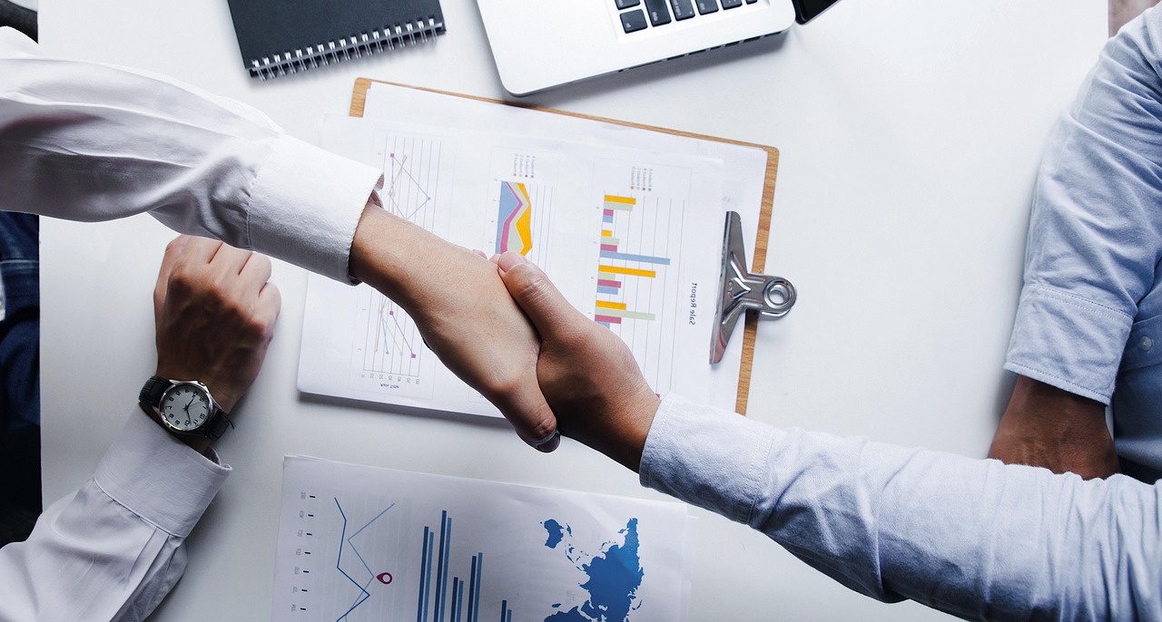 People shaking hands. Image by Pexels.