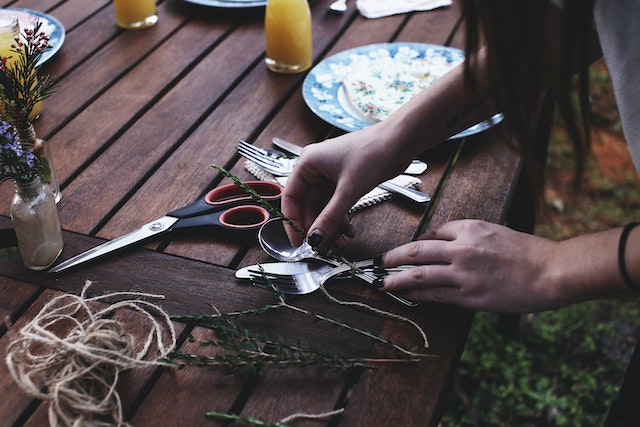 person decorating a table